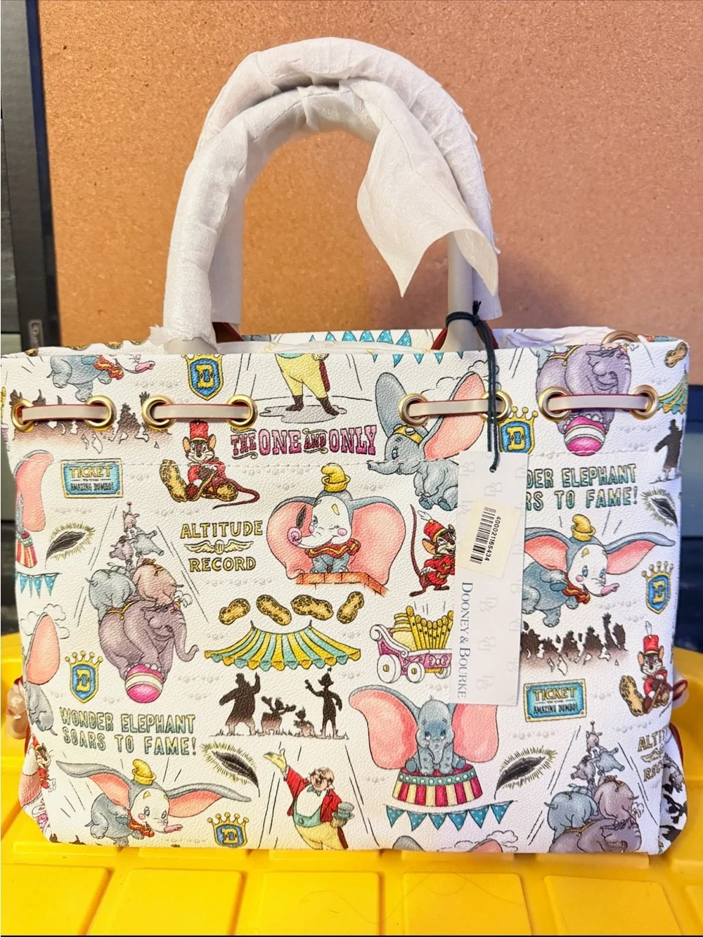 Disney Dooney and Bourke Dunbo Printed Satchel in White, Pink and Gold Accents